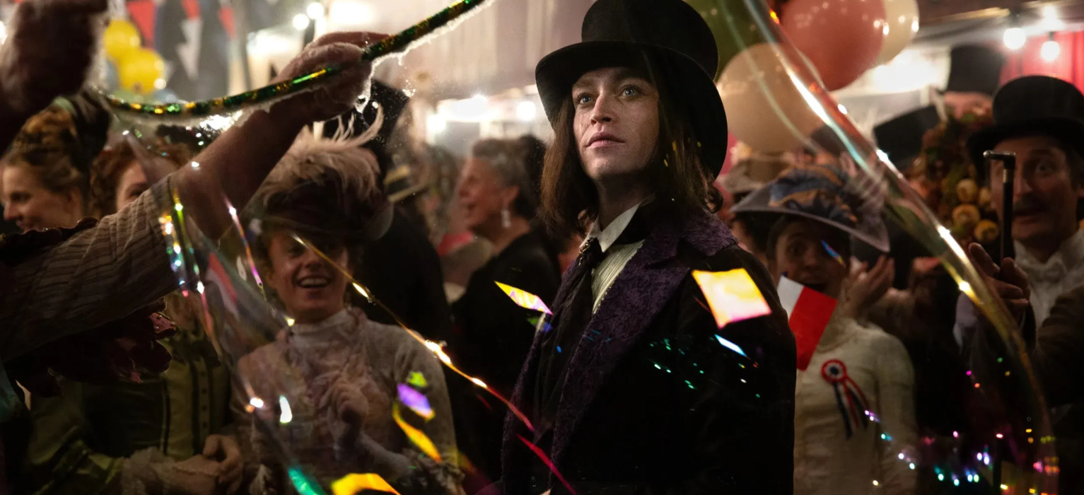 Gothic man in Victorian clothing at a festive carnival scene in Dracula: A Love Tale.